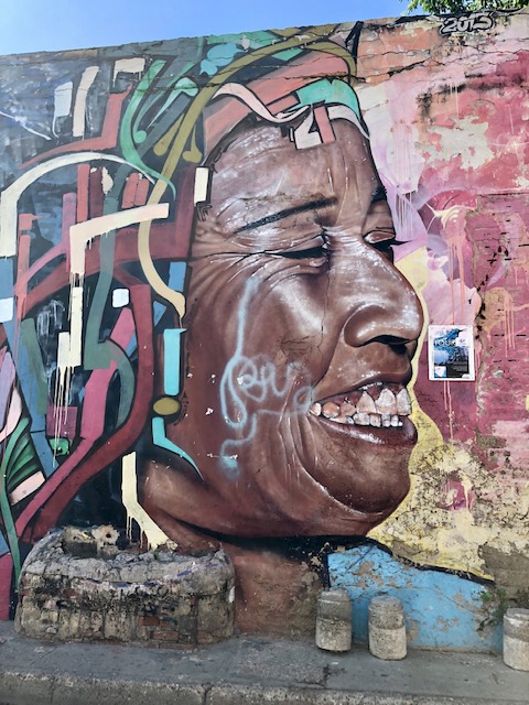 what to do in cartagena, cartagena turismo, tripadvisor cartagena,  colombia, getsemani, street art, mural of a dark-skinned woman's face
