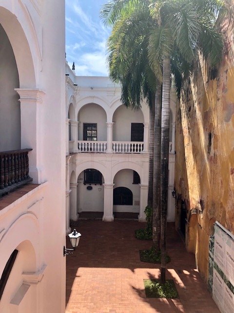 what to do in cartagena, cartagena turismo, tripadvisor cartagena,  colombia, white colonial building with palm trees