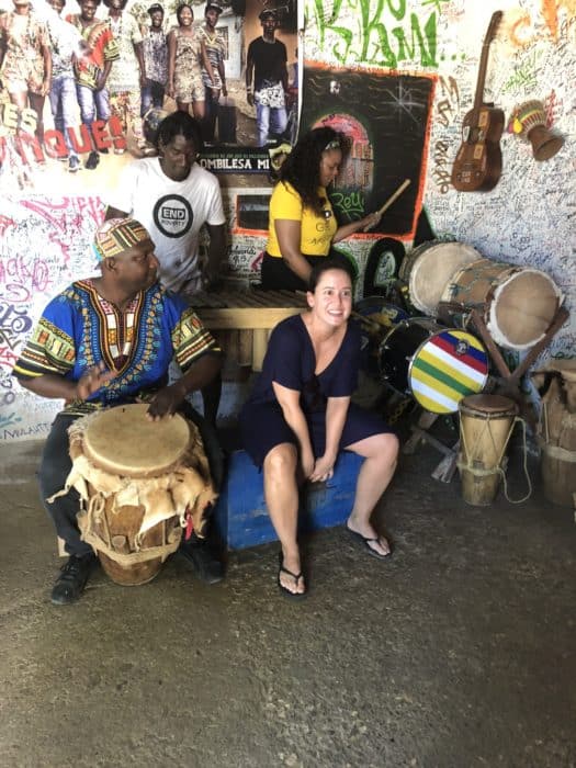 Best day trip from Cartagena, san Basilio de palenque, palenque de san basilio, day trips from cartagena, what to do in cartagena, people playing musical instruments