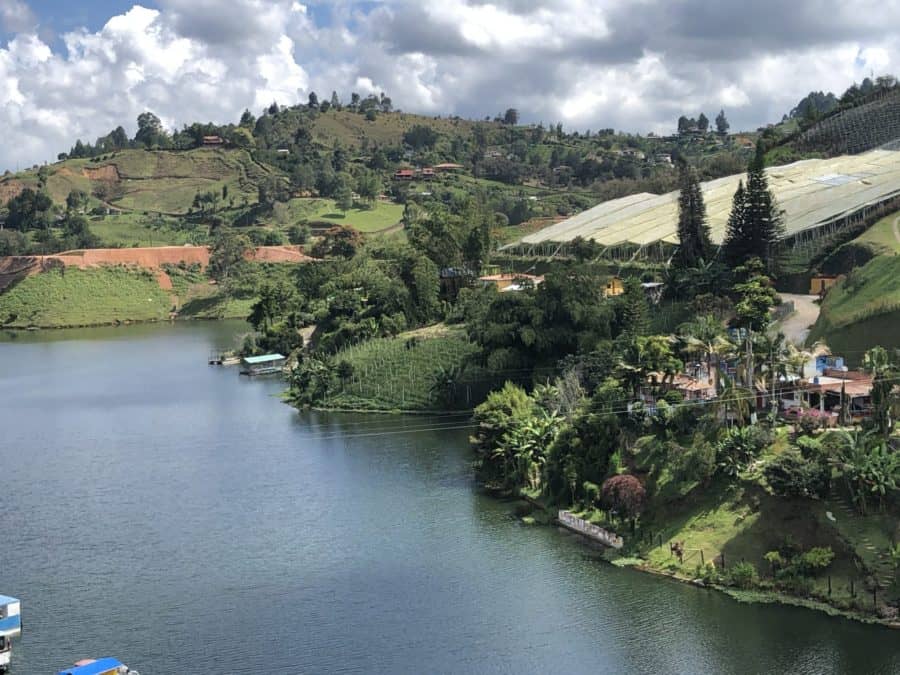 medellin, things to do in medellin, Guatapé, Guatape colombia, day trips from medellin, guatape, places to visit in colombia, colombia tourist attractions, day trips from medellin, lush green land overlooking the water