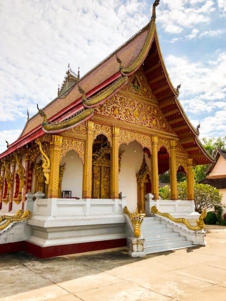 what to do in luang prabang, luang prabang temples, unesco, unesco world heritage, wat nong sikhounmuang, sikhounmuang, wat, gold and red temple with white steps