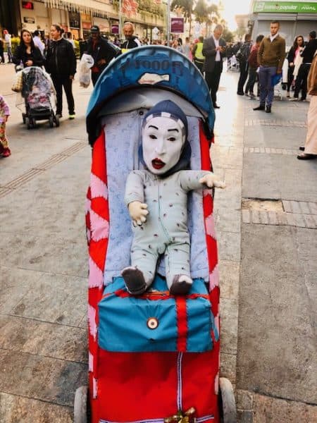 things to see in bogota, colombia tourist attractions, clown baby in a stroller