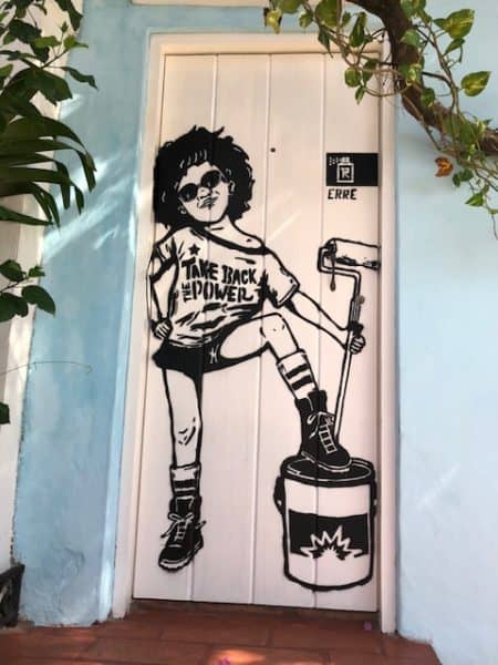 what to do in cartagena, cartagena turismo, tripadvisor cartagena, things to do in Cartagena, colombia, getsemani, street art, mural of a woman wearing a shirt that says take back the power