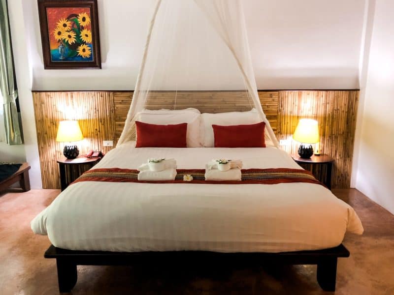 luxury travel, ban sainai resort, krabi town, thailand, beautifully decorated bed