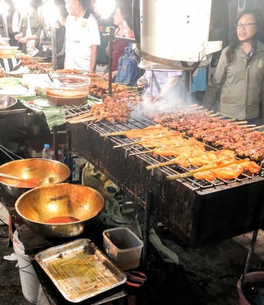 bangkok night market, things to do in bangkok, woman grilling meat