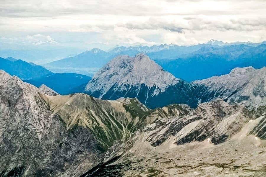 view from zugspitze mountain, amazing snow capped mountains up close and in the distance