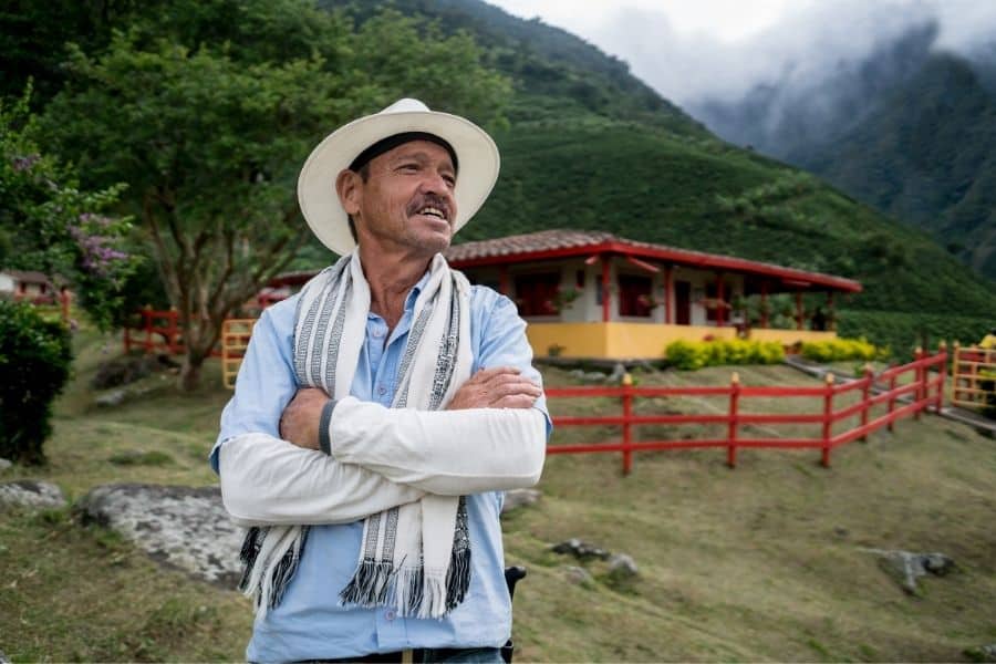 colombian man at a finca, colombia safe, colombia safety, is colombia safe to travel alone, is bogota colombia safe, is medellin colombia safe, os colombia safe to travel alone, colombia safe to travel, is travel to colombia safe, is colombia safe for travel, is it safe to travel to colombia, is it safe to travel to colombia alone, is colombia safe to travel alone, is colombia safe for tourists
