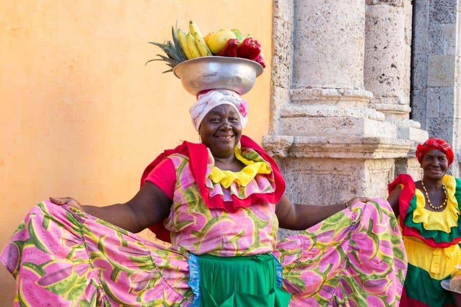 palenquera, palenque, carriage square, cartagena, woman with a bowl of fruit on her head