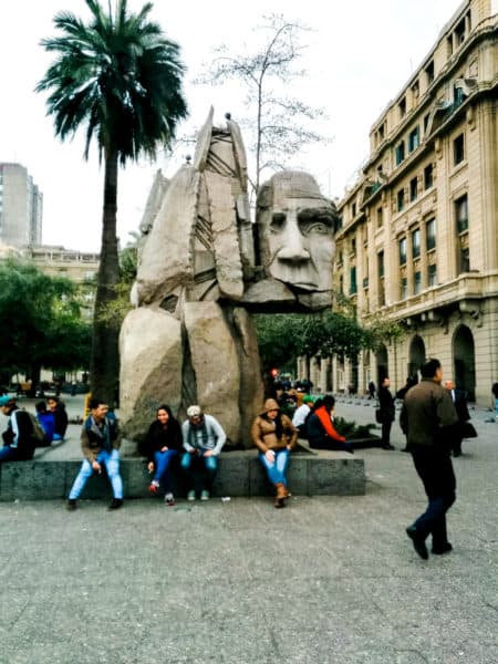 abstract statue of a body holding a head, things to do in santiago chile, thingst to do in santiago, santiago things to do, santiago chile things to do, best things tod o in santiago chile, things to see in santiago chile, santiago tourist attractions, places to visit in santiago chile, santiago sightseeing, things to see in santiago chile, santiago chile attractions, airbnb santiago chile, what to do in santiago chile, things to do in santiago, santiago chile things to do, santiago things to do, downtown santiago chile, attractions in santiago, plaza de armas