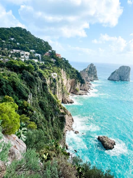 cliff view of the rocks, clear blue ocean, turquoise water, faraglioni rocks, capri italy, capri island, things to do in capri