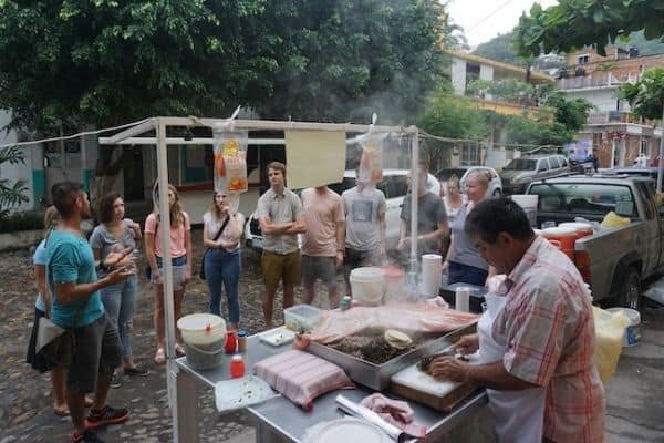 people watching a local cook on a food tour, best food in puerto Vallarta, best things to do in puerto Vallarta