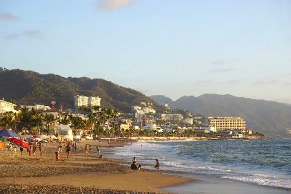beach view, waves crashing, people sitting on the beach, best beaches in puerto Vallarta, beaches in puerto Vallarta,