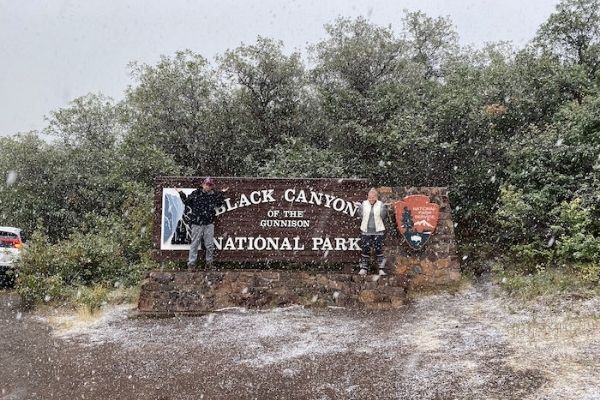 snow around the black canyon entrance sign, 