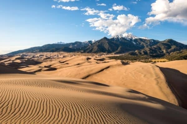 pictures of the dunes under a sunny sky, great sand dunes weather, great sand dunes national park and preserve