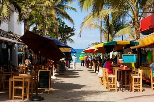 sayulita restaurants and bars, ocean in the distance, palm trees, puerto vallarta to sayulita
