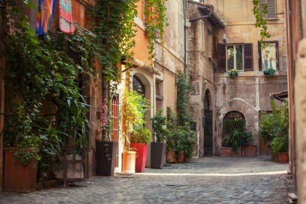 cobbestone street, old buildings, outdoor plants, trastevere in rome