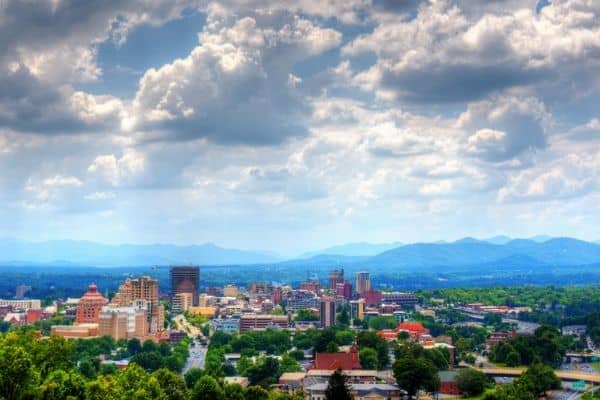 aerial view of asheville skyline, cloudy sky, day trips in nc, day trips from asheville nc, when to visit asheville nc