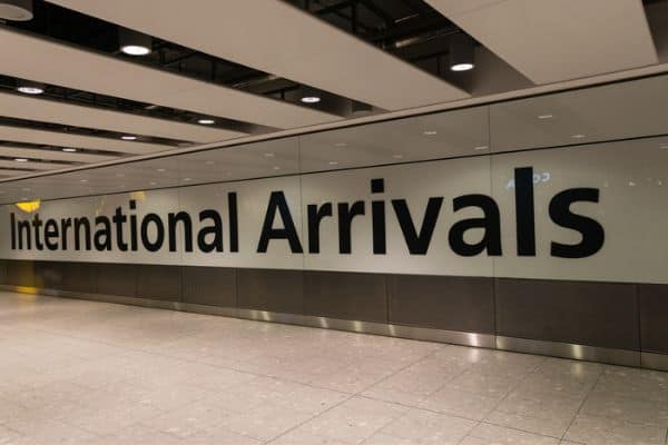 international arrivals sign at heathrow airport