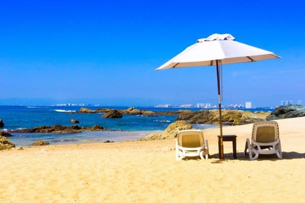 beach bar, beach chairs and table in the sand, 