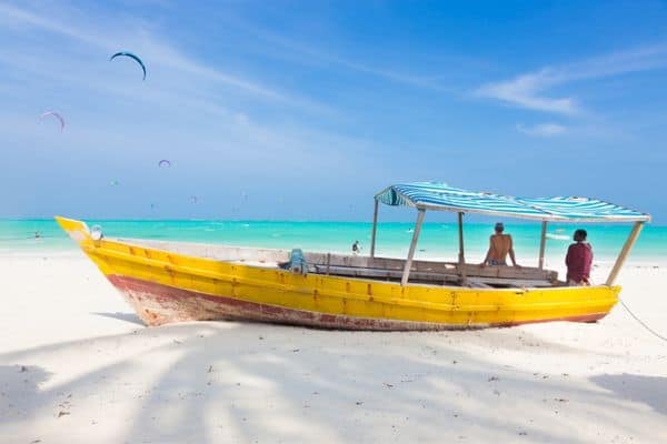 yellow boat in the sand, where to stay in zanzibar
