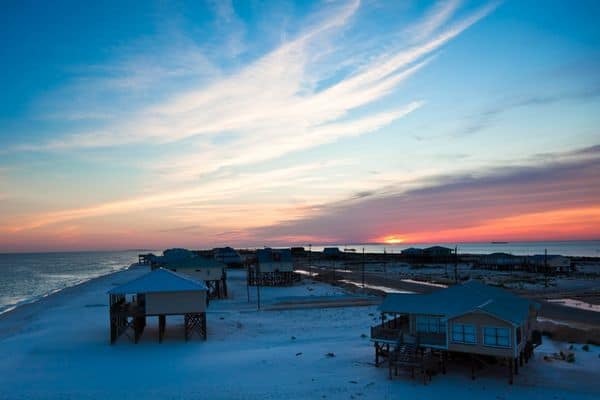 dauphin island hotels, sunset over the beach, houses on stilts