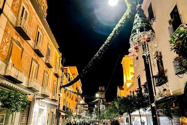 street in sorrento, christmas decorations hanging from light poles