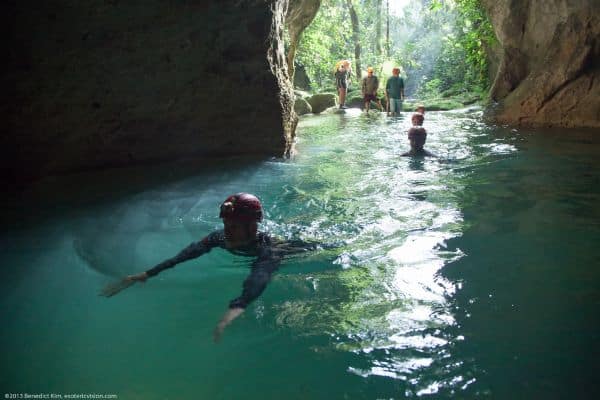people swimming in the waters of the ATM cave, rio frio cave, cave tour