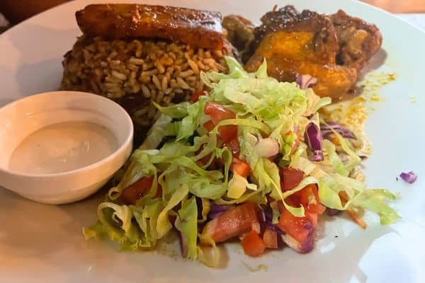 rice and beans with a stewed chicken salamd food in belize