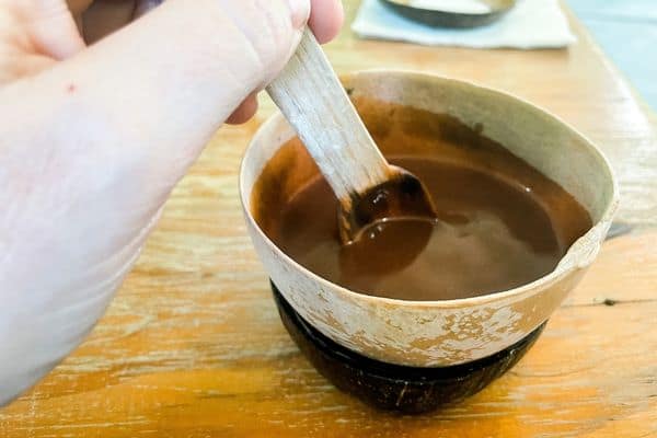 stirring hot chocolate in cup