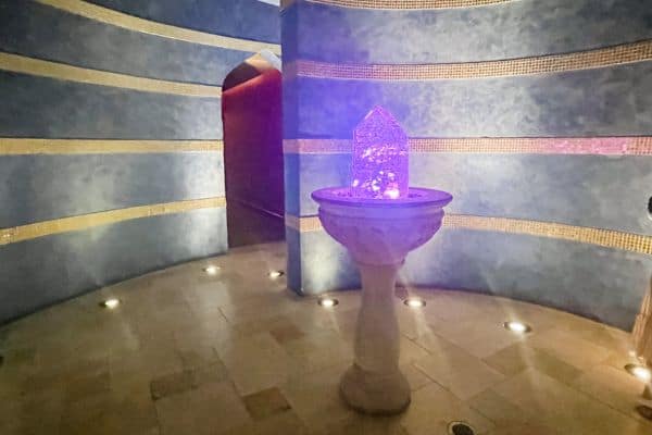 crystal quartz stand radiating purple and pink light