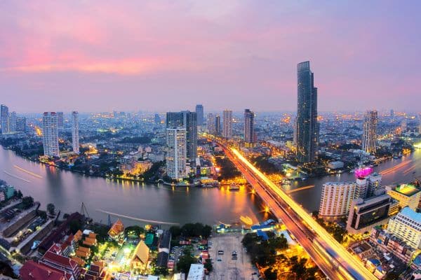aeriel view of bangkok at sunset, bridge crossing over the river, areas in bangkok, areas of bangkok