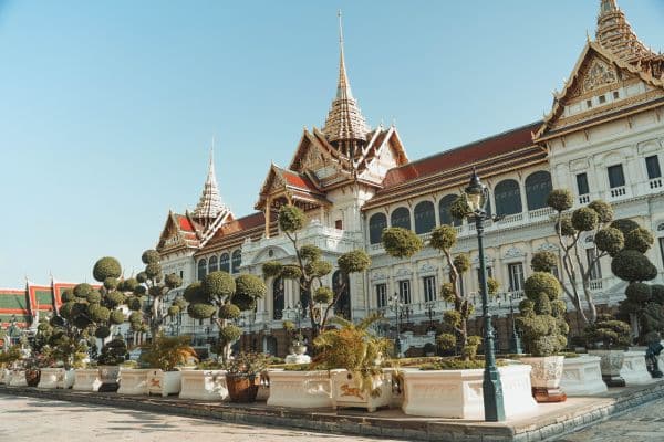 royal palace, traditional thai architecture, manicured trees and garden