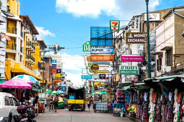 khao san road, signs for 7eleven drugstore, colorful shop signs, best places to stay in bangkok, areas to stay in bangkok