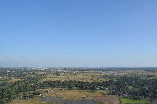 view of the siem reap landscape, grassy plains, blue sky 