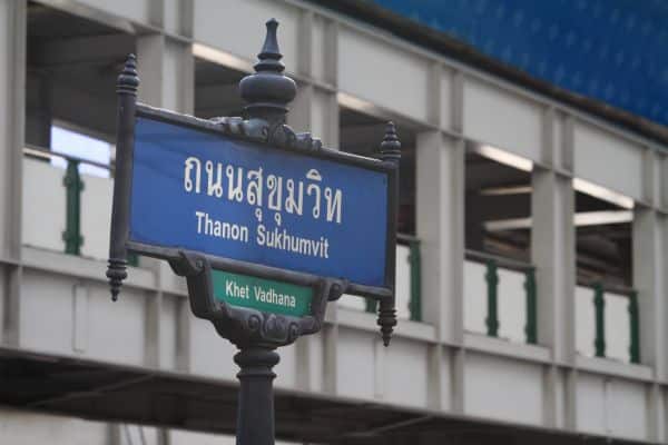 sign for the thanon sukhumvit train stop, blue sign written in thai and english, places to stay in bangkok, where to stay in bangkok