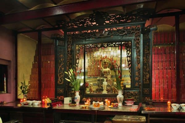 inside of jade emperor pagoda, buddhist altar with plants and incense, itinerary ho chi minh, ho chi mih itinerary