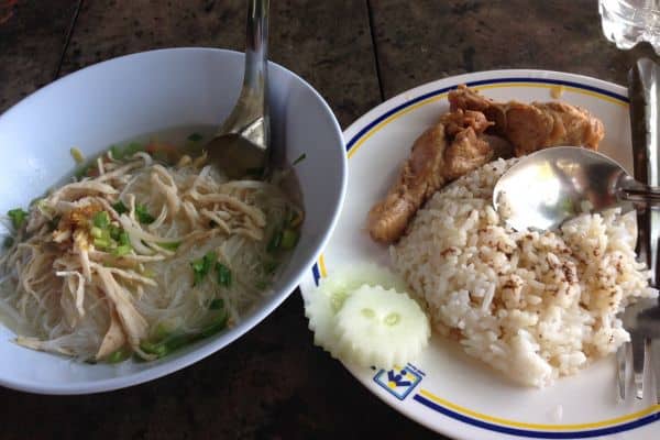 traditional thai food served at a restaurant in the waterfront community, bowl of chicken, noodles, and shop, plate of rice with chicken, living in hanthaburi