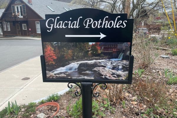 sign pointing to the glacial potholes, things to in western massachusetts