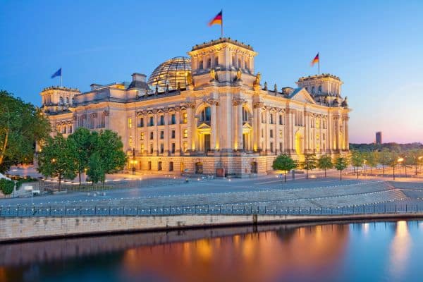 german government building with german flags flying on top of it, things to do in berlin