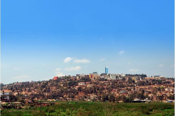 kigali rwanda skyline, clear blue skies in the background, skyline on top of the hill