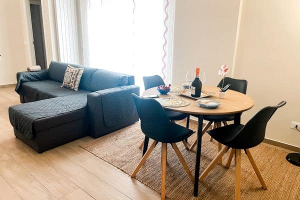 couch and dining table in the airbnb
