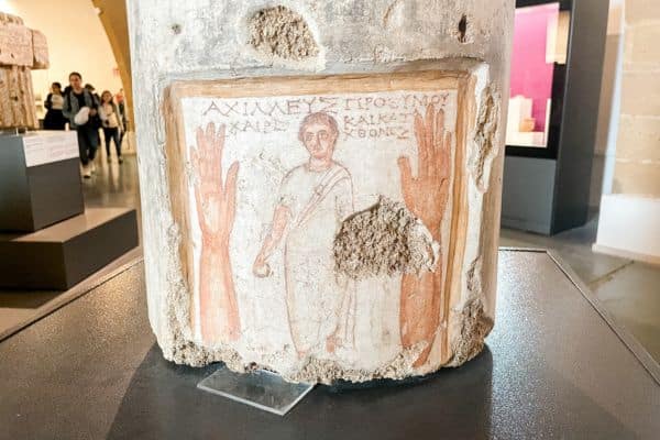 ancient painting on a piece of a stone column 