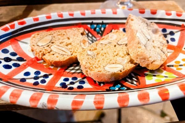 bread with nuts and grain inside on a colorful plate