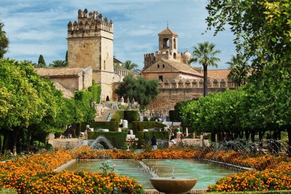 old castle in cordoba, courtyard with flowers and ponds, places to stay in cordoba spain, where to stay in cordoba spain