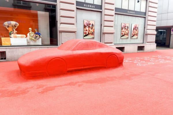 red square, porsche covered in red carpet