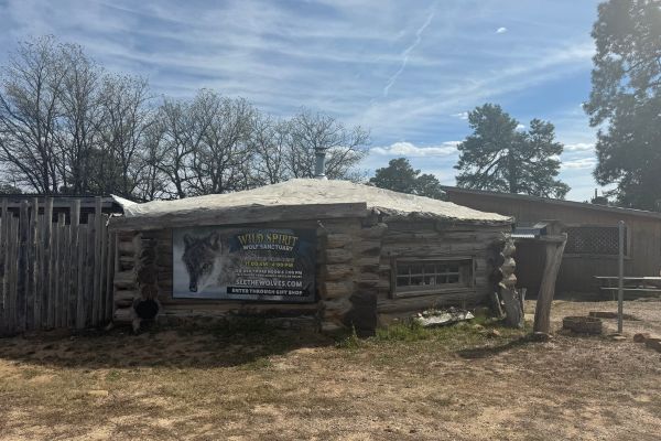 outside of the sanctuary with sign advertising the place, new mexico wolf sanctuary, Wild spirit wolf sanctuary new mexico, Wild spirit 