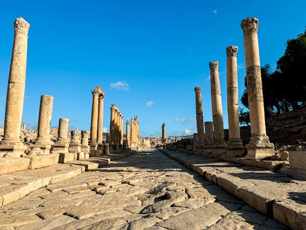 ancient city of jerash, stone walkway with columns lining the sides, g adventures highlights of jordan