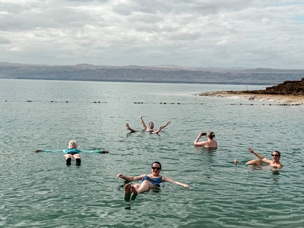 me and some of the other people in my group floating in the dead sea, g adventures highlights of jordan